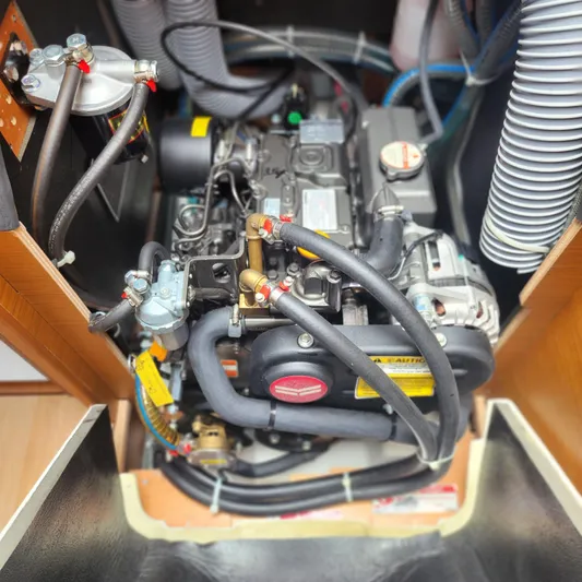 Skye Yacht Photos Pics Engine compartment of 2023 Jeanneau Sun Odyssey 349 sailboat, showcasing detailed mechanical components.