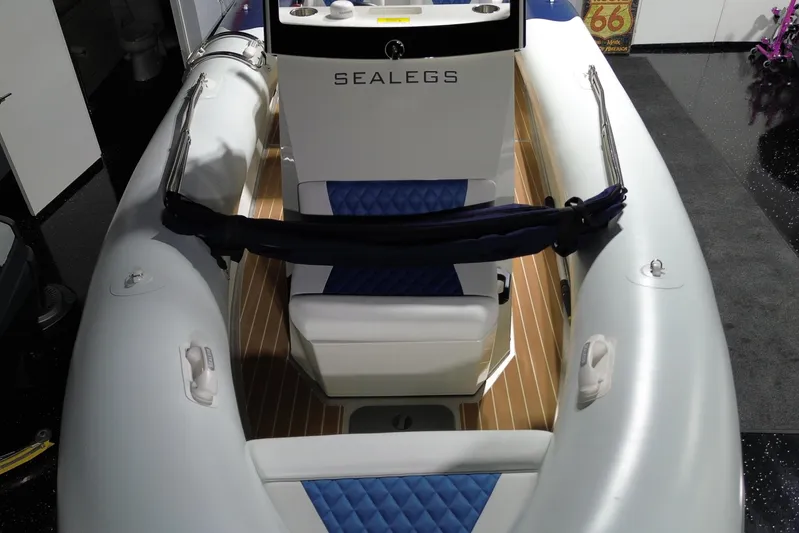 7.5m Hydrasol Rib Yacht Photos Pics 2021 Sealegs 7.5M RIB boat interior with blue seating and wood accents.