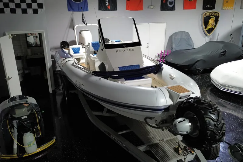 7.5m Hydrasol Rib Yacht Photos Pics 2021 Sealegs 7.5M RIB in showroom, featuring amphibious wheels and sleek design.