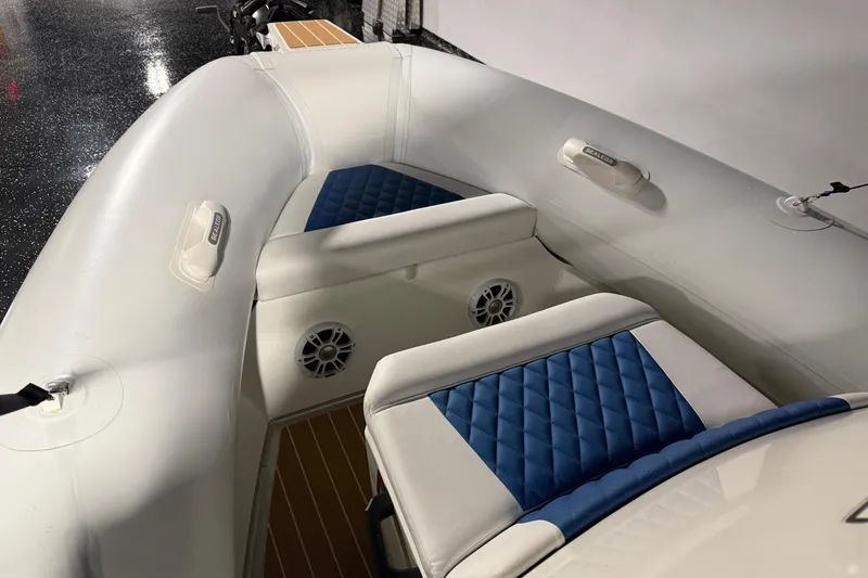7.5m Hydrasol Rib Yacht Photos Pics 2021 Sealegs 7.5M RIB with blue and white seating, showcasing interior design.
