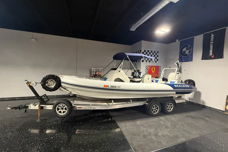 7.5m Hydrasol Rib Yacht Photos Pics 2021 Sealegs 7.5M RIB on trailer in showroom with luxury car banners.