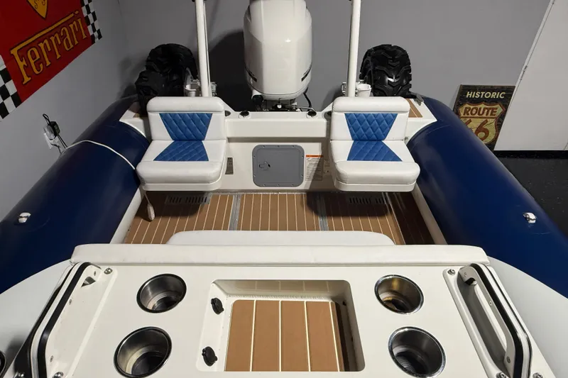 7.5m Hydrasol Rib Yacht Photos Pics 2021 Sealegs 7.5M RIB interior with blue seating and wood flooring.