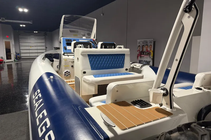 7.5m Hydrasol Rib Yacht Photos Pics 2021 Sealegs 7.5M RIB boat with blue seating, displayed indoors.