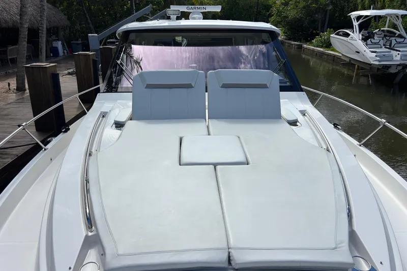  Yacht Photos Pics 2024 Pursuit OS 445 Offshore boat with spacious sun deck and sleek design.