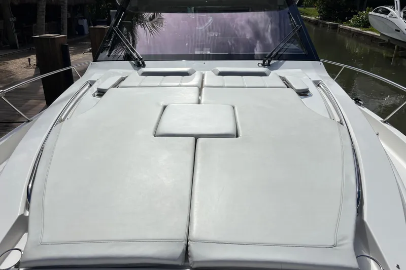  Yacht Photos Pics 2024 Pursuit OS 445 Offshore boat with spacious sun deck and sleek design.