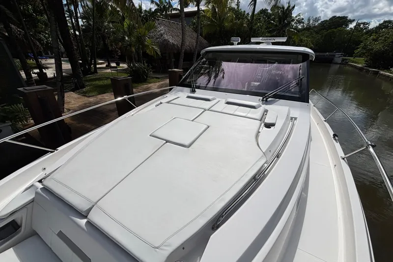  Yacht Photos Pics 2024 Pursuit OS 445 Offshore boat with spacious deck and sleek design.