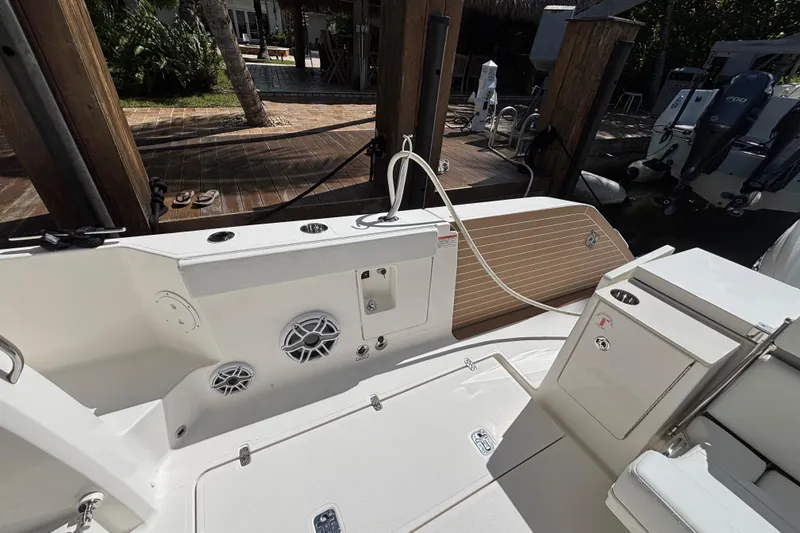  Yacht Photos Pics 2024 Pursuit OS 445 Offshore boat deck with speakers and storage compartments.