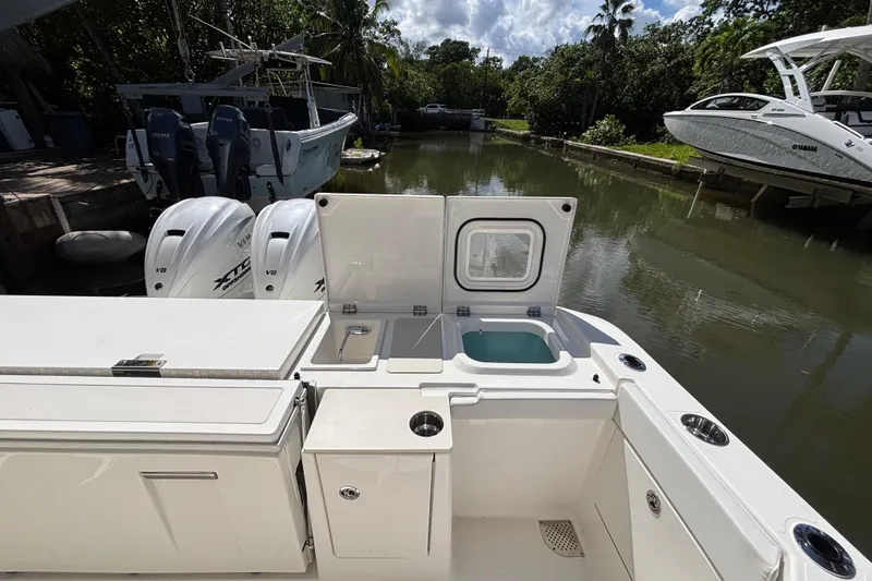  Yacht Photos Pics 2024 Pursuit OS 445 Offshore boat with open deck and dual outboard engines.