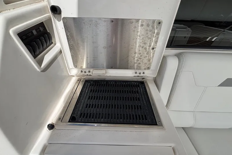  Yacht Photos Pics 2024 Pursuit OS 445 Offshore boat grill and control panel detail.