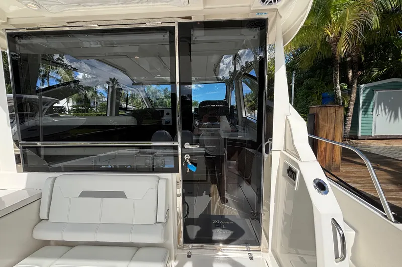  Yacht Photos Pics 2024 Pursuit OS 445 Offshore yacht interior with sleek design and luxurious seating.