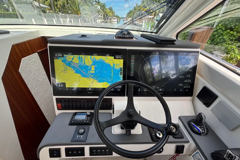  Yacht Photos Pics 2024 Pursuit OS 445 Offshore helm with advanced navigation displays and controls.