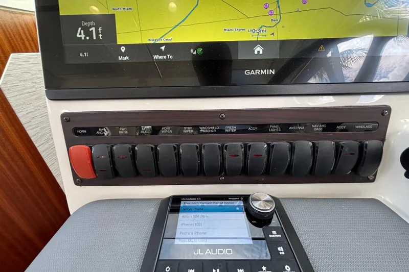  Yacht Photos Pics 2024 Pursuit OS 445 Offshore dashboard with Garmin navigation and JL Audio system.