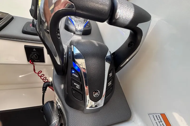  Yacht Photos Pics Close-up of 2024 Pursuit OS 445 Offshore boat controls with Yamaha throttle system.