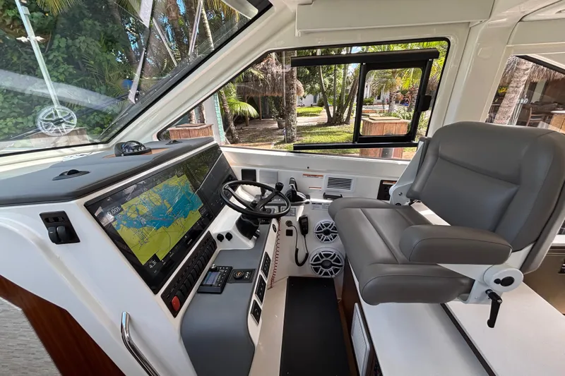  Yacht Photos Pics 2024 Pursuit OS 445 Offshore helm with advanced navigation system and comfortable seating.