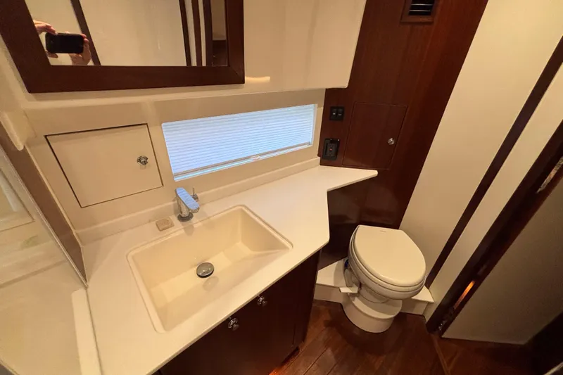  Yacht Photos Pics Luxurious bathroom in 2024 Pursuit OS 445 Offshore yacht with modern fixtures.