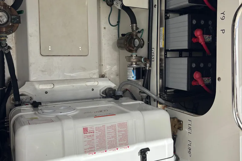  Yacht Photos Pics 2024 Pursuit OS 445 Offshore engine compartment with batteries and fuel pump.