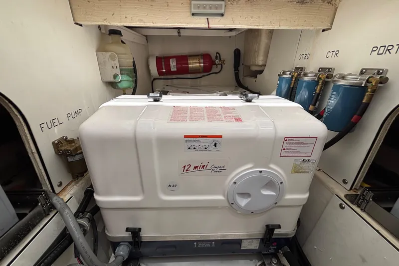  Yacht Photos Pics Engine room of 2024 Pursuit OS 445 Offshore with generator and fuel system components.