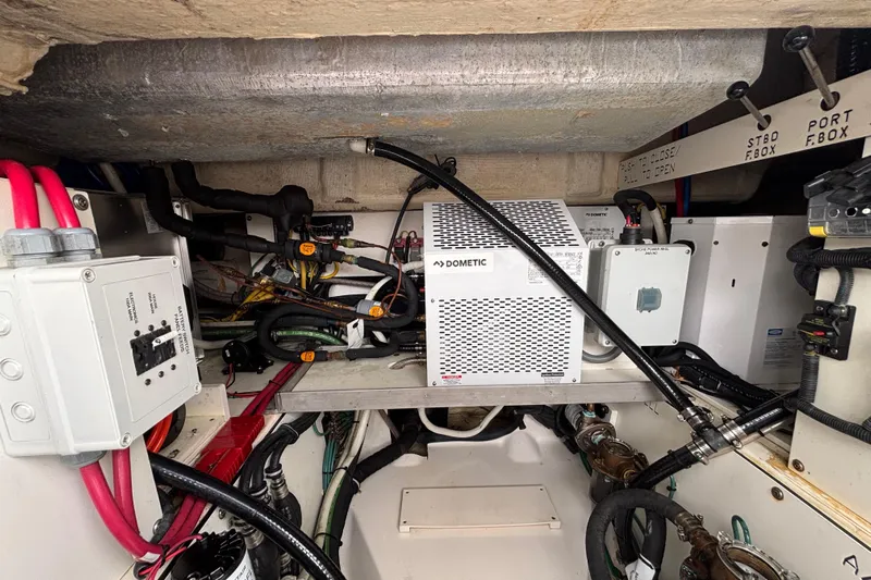  Yacht Photos Pics Engine compartment of 2024 Pursuit OS 445 Offshore boat with Dometic equipment and wiring.