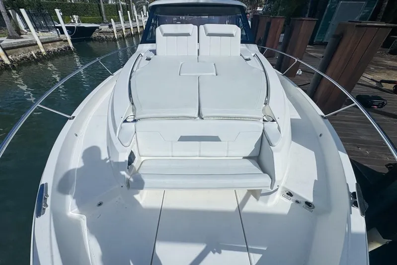  Yacht Photos Pics 2024 Pursuit OS 445 Offshore boat with spacious deck and seating area.