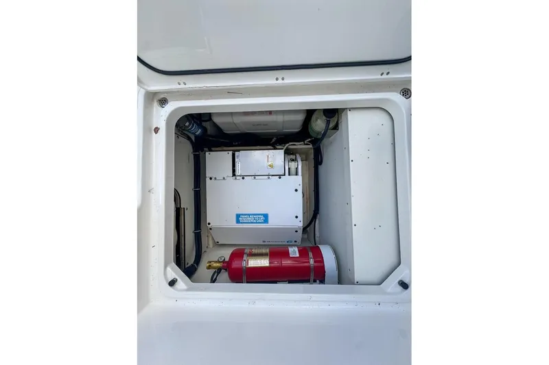  Yacht Photos Pics 2024 Pursuit OS 445 Offshore engine compartment with fire extinguisher and equipment.