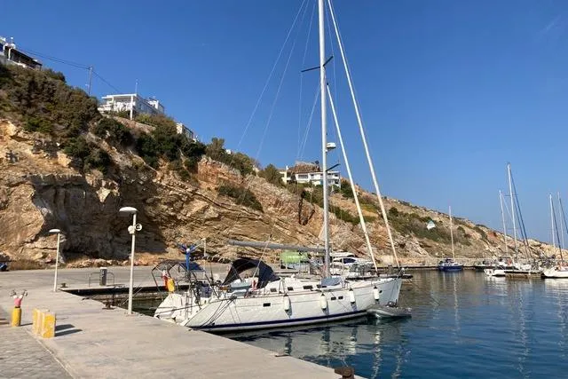  Yacht Photos Pics 2006 Beneteau Oceanis Clipper 473 docked at a scenic marina with rocky cliffs.