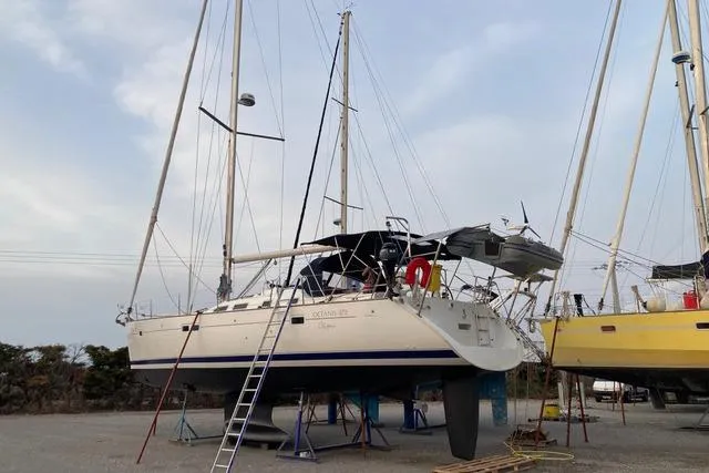  Yacht Photos Pics 2006 Beneteau Oceanis Clipper 473 sailboat on dry dock with ladder access.
