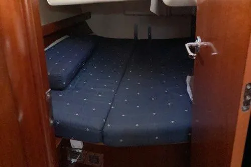  Yacht Photos Pics Cozy cabin interior of 2006 Beneteau Oceanis Clipper 473 sailboat.