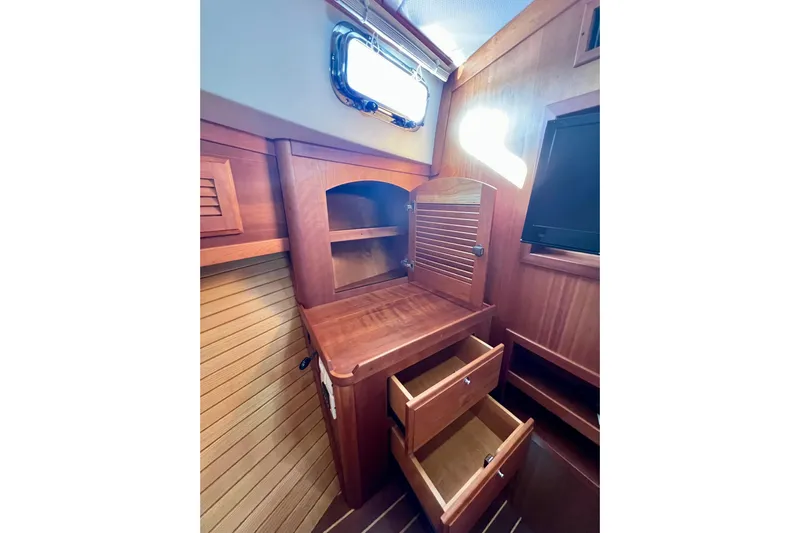 Island Time Yacht Photos Pics 2006 Sabre 38 Hard Top Express interior with wooden cabinetry and open drawers.