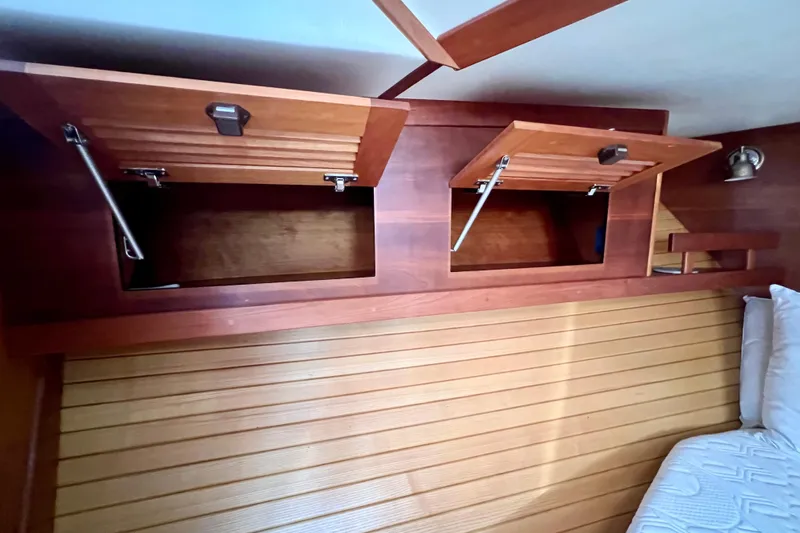 Island Time Yacht Photos Pics 2006 Sabre 38 Hard Top Express interior with open wooden storage compartments.