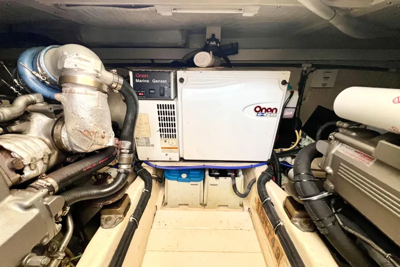 Island Time Yacht Photos Pics Engine room of 2006 Sabre 38 Hard Top Express with Onan marine generator.