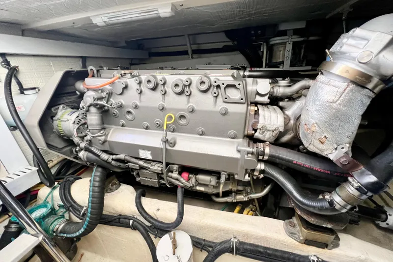 Island Time Yacht Photos Pics Engine compartment of 2006 Sabre 38 Hard Top Express boat, showcasing detailed machinery.