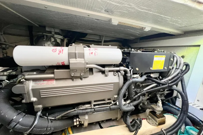 Island Time Yacht Photos Pics Engine compartment of 2006 Sabre 38 Hard Top Express boat, showcasing detailed machinery.