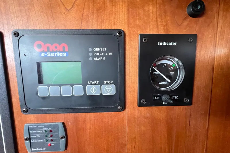 Island Time Yacht Photos Pics Control panel of a 2006 Sabre 38 Hard Top Express boat with Onan e-Series display.