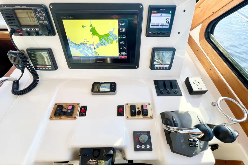 Island Time Yacht Photos Pics 2006 Sabre 38 Hard Top Express helm with navigation and control systems.