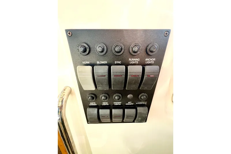 Island Time Yacht Photos Pics Control panel of a 2006 Sabre 38 Hard Top Express boat with labeled switches.