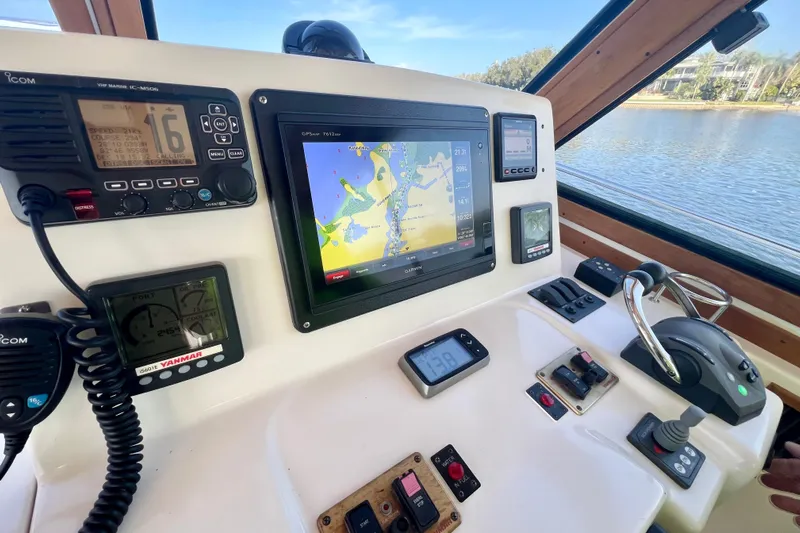 Island Time Yacht Photos Pics Control panel of 2006 Sabre 38 Hard Top Express with navigation and communication equipment.