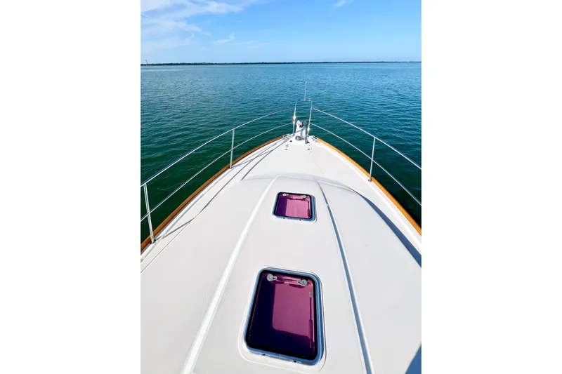 Island Time Yacht Photos Pics Bow view of 2006 Sabre 38 Hard Top Express on calm water.