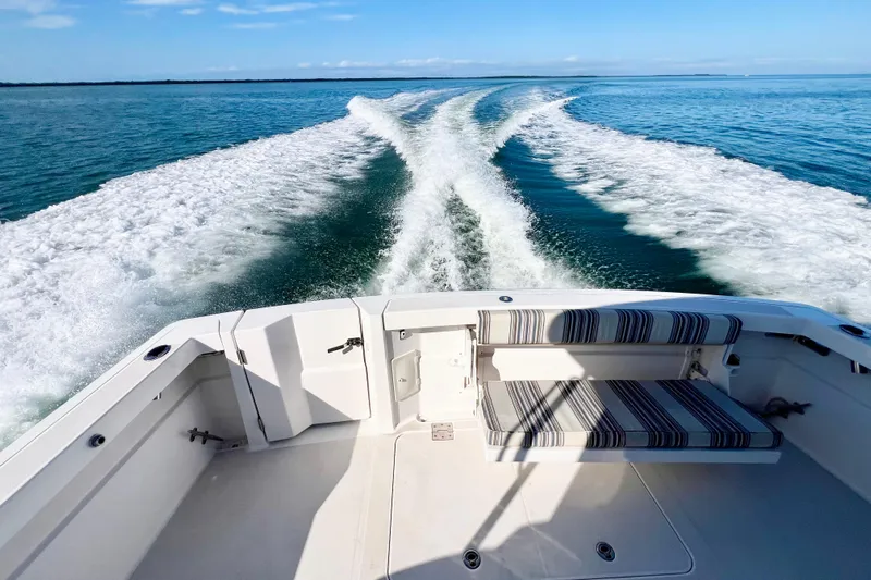 Island Time Yacht Photos Pics 2006 Sabre 38 Hard Top Express cruising on open water, leaving a wake trail.