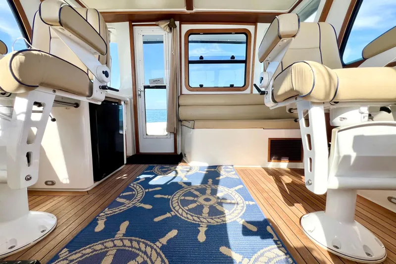 Island Time Yacht Photos Pics Interior of 2006 Sabre 38 Hard Top Express with nautical-themed decor and seating.