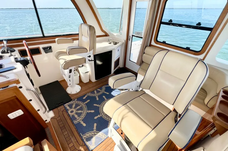 Island Time Yacht Photos Pics Interior of 2006 Sabre 38 Hard Top Express yacht with leather seating and ocean view.