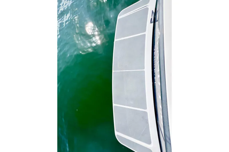 Island Time Yacht Photos Pics 2006 Sabre 38 Hard Top Express swim platform above green water.