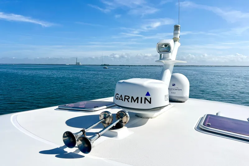 Island Time Yacht Photos Pics 2006 Sabre 38 Hard Top Express yacht with Garmin equipment on calm sea.