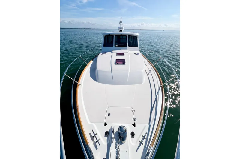 Island Time Yacht Photos Pics 2006 Sabre 38 Hard Top Express yacht on calm water, sunny day.