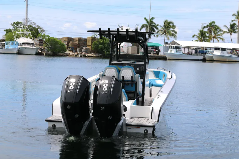  Yacht Photos Pics 2025 Concept 30 Open Deck boat with dual 300 V8 engines on calm water.