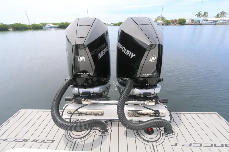  Yacht Photos Pics Twin Mercury Verado engines on 2025 Concept 30 Open Deck boat, docked on calm water.