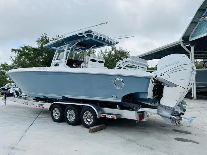  Yacht Photos Pics 2020 Fountain 38cc boat on a triple-axle trailer with twin Mercury outboard engines.