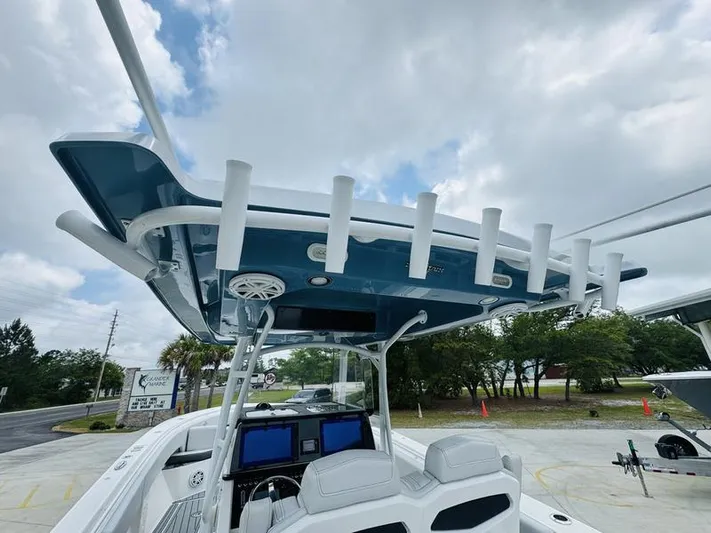  Yacht Photos Pics 2020 Fountain 38cc boat with dual helm seats and overhead rod holders.