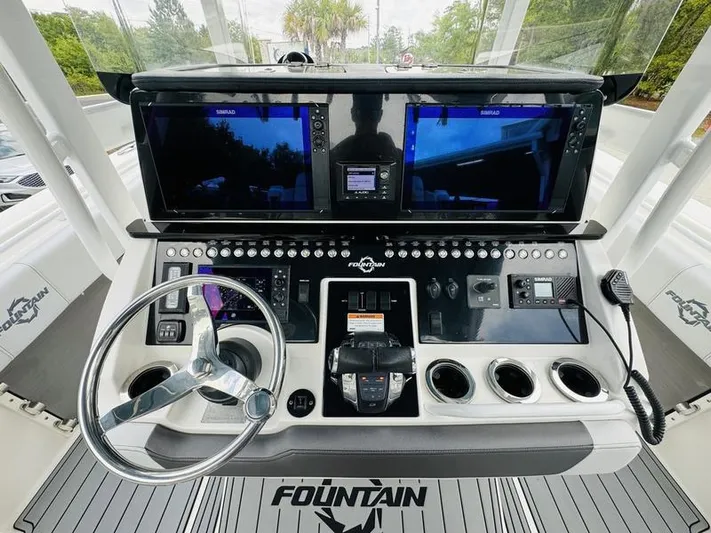  Yacht Photos Pics 2020 Fountain 38cc boat dashboard with advanced navigation systems and controls.