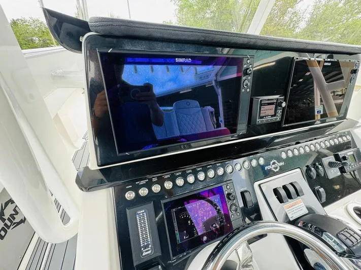  Yacht Photos Pics Control panel of a 2020 Fountain 38cc boat with Simrad navigation system.