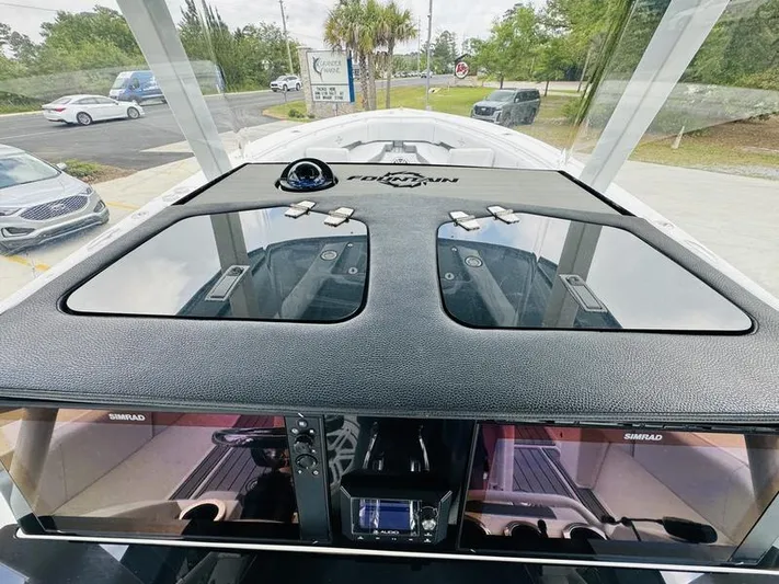  Yacht Photos Pics 2020 Fountain 38cc boat dashboard with Simrad displays and navigation equipment.